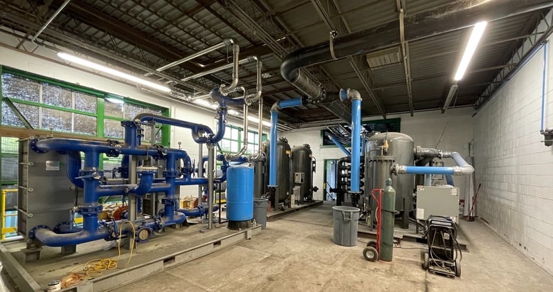 industrial facility with compressed air system compressors and piping